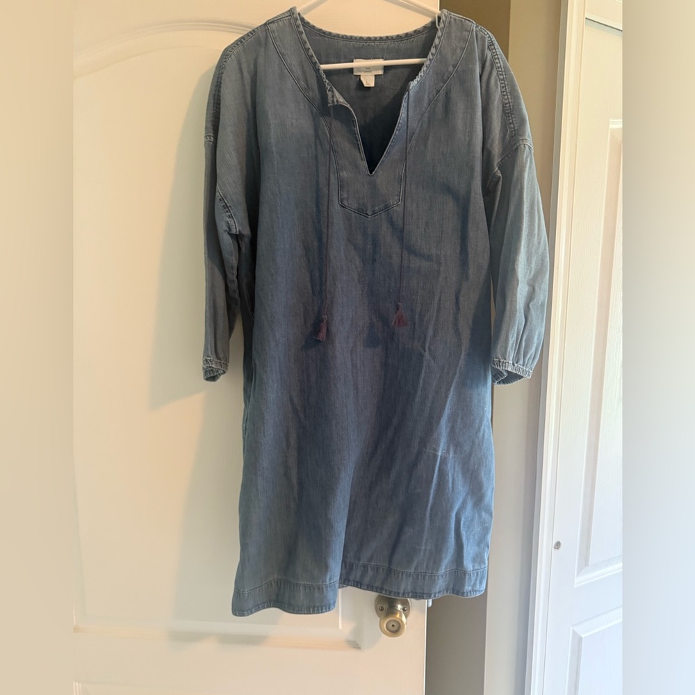 Loft size large light denim dress. Knee length with v neck and tassels.
